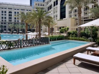 Outdoor pool area in 3-bedroom residence at Palazzo Versace