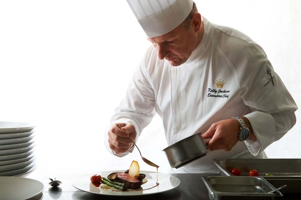 Chef decorating the plate at Crown Hotel Melbourne