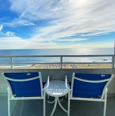 A Balcony with blue chairs with a sea view, Ocean Place Resort