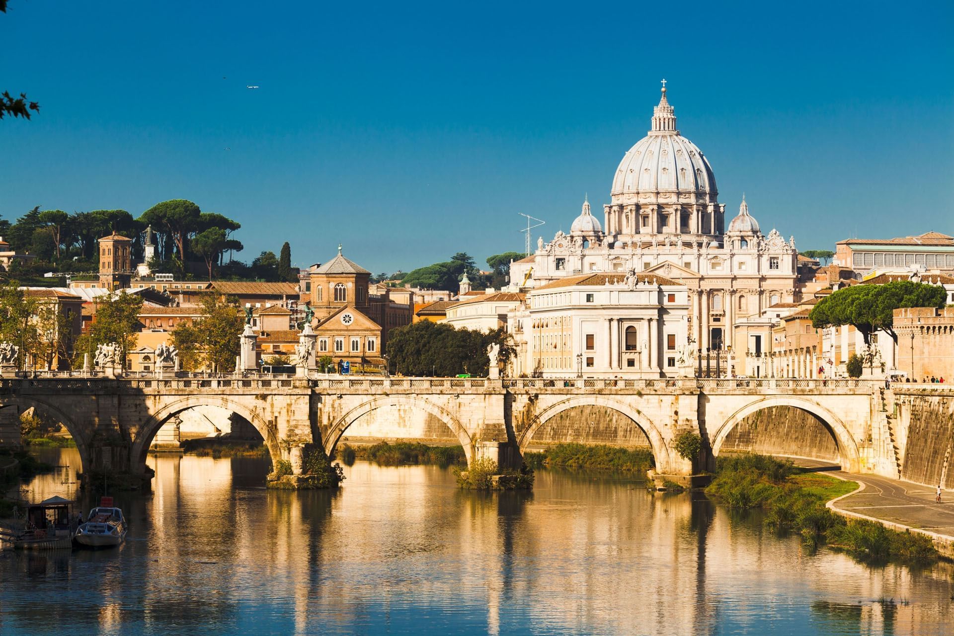 Panoramic view of St. Peter's Basilica with river near Rome Luxury Suites