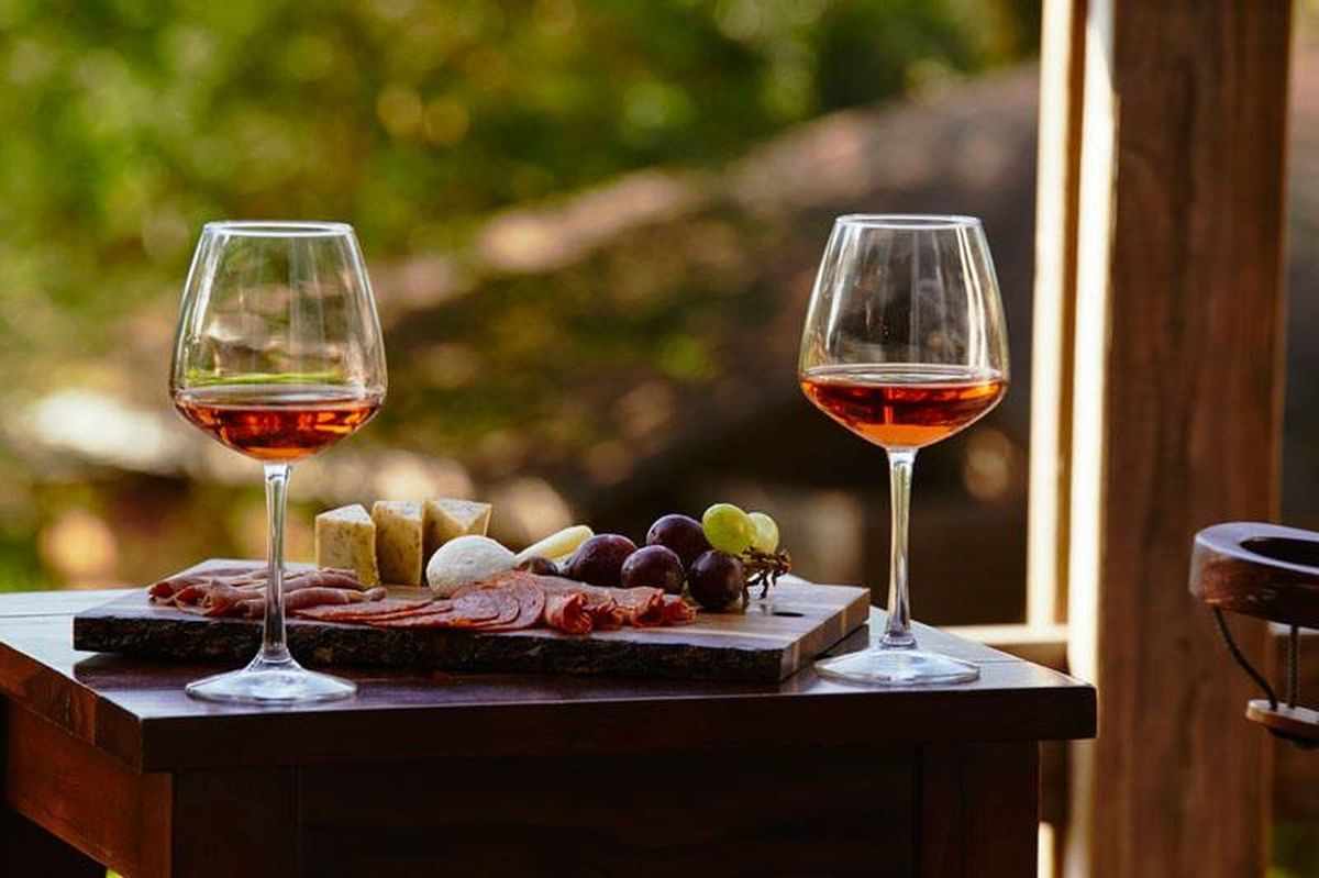 charcuterie plate with two wine glasses