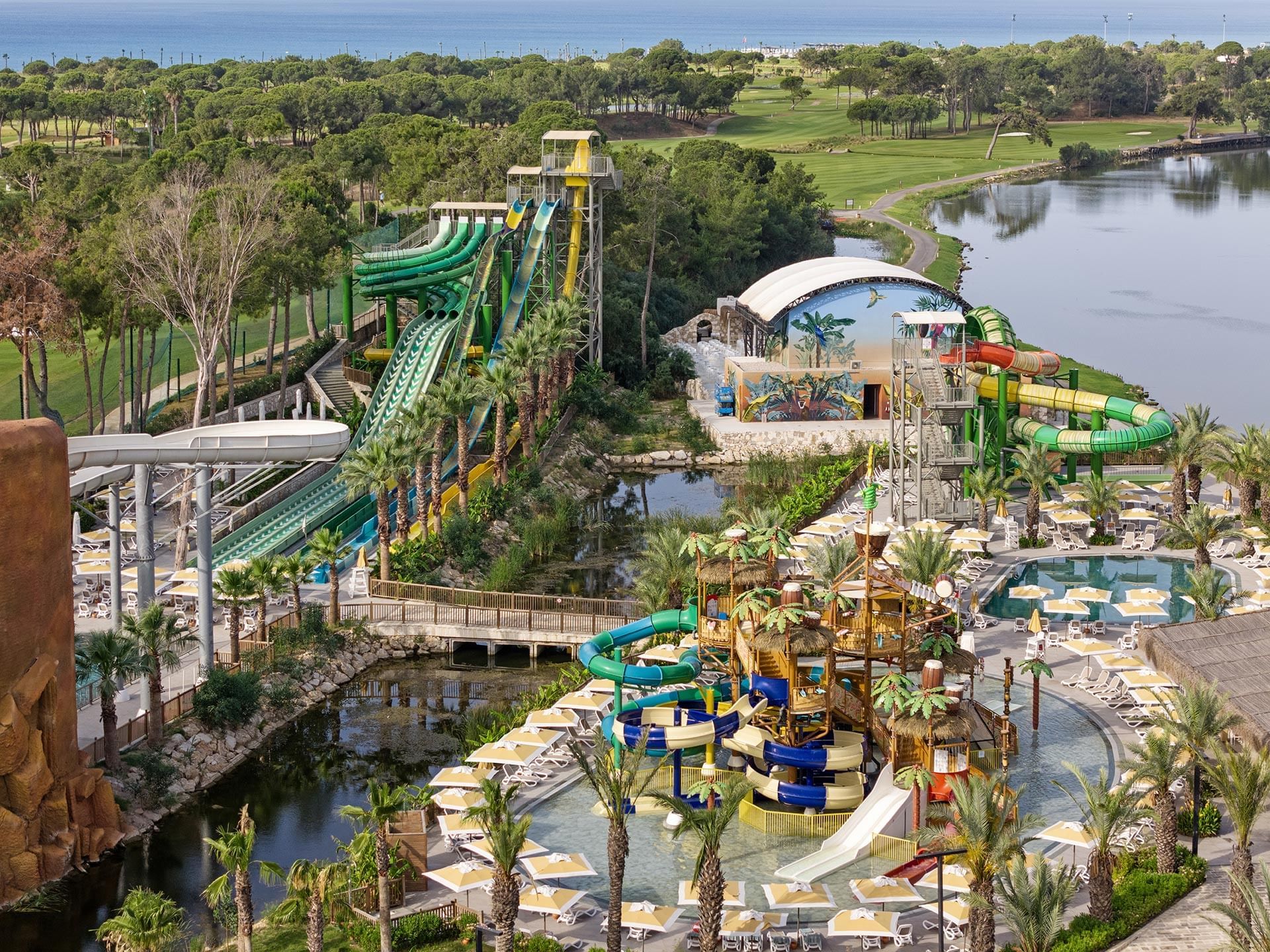 High-angle view of Aquapark Slides and river on a sunny day at Titanic Deluxe Golf Belek