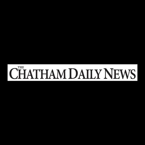 Logo of the Chatham Daily News at Retro Suites Hotel