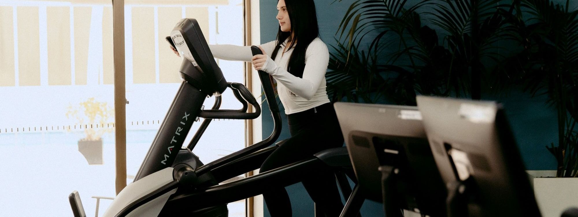 Woman using a treadmill at Novotel Sydney Parramatta in Parramatta
