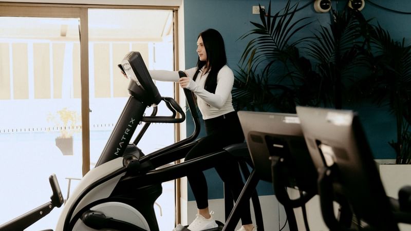 Woman using a treadmill at Novotel Sydney Parramatta in Parramatta.