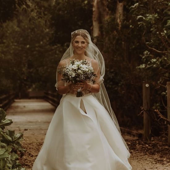 Bride posing for a photo at Pullman Palm Cove Sea Temple Resort