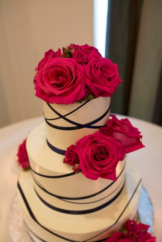 3 Layers of wedding cake with flowers at The Venue at Portwalk