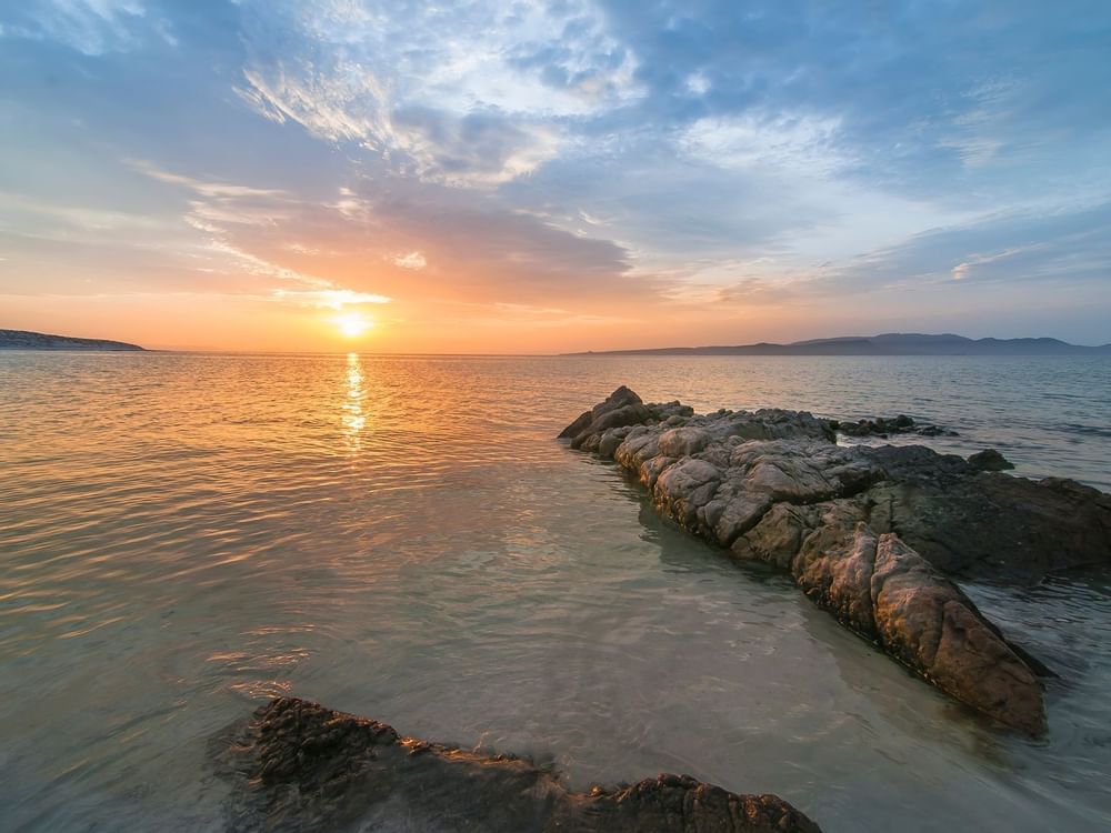 La Paz beach at dawn near La Colección Resorts