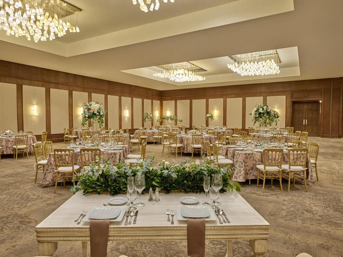 The wedding hall arranged with tables & chairs at FA Hotels