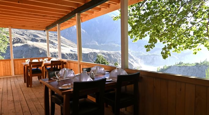 Dining tables by mountain view in Khabasi at Serena Altit Fort