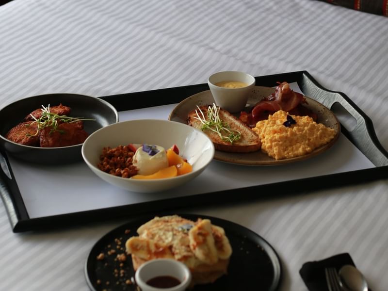 Close-up of various dishes arranged on a table at Pullman Albert Park