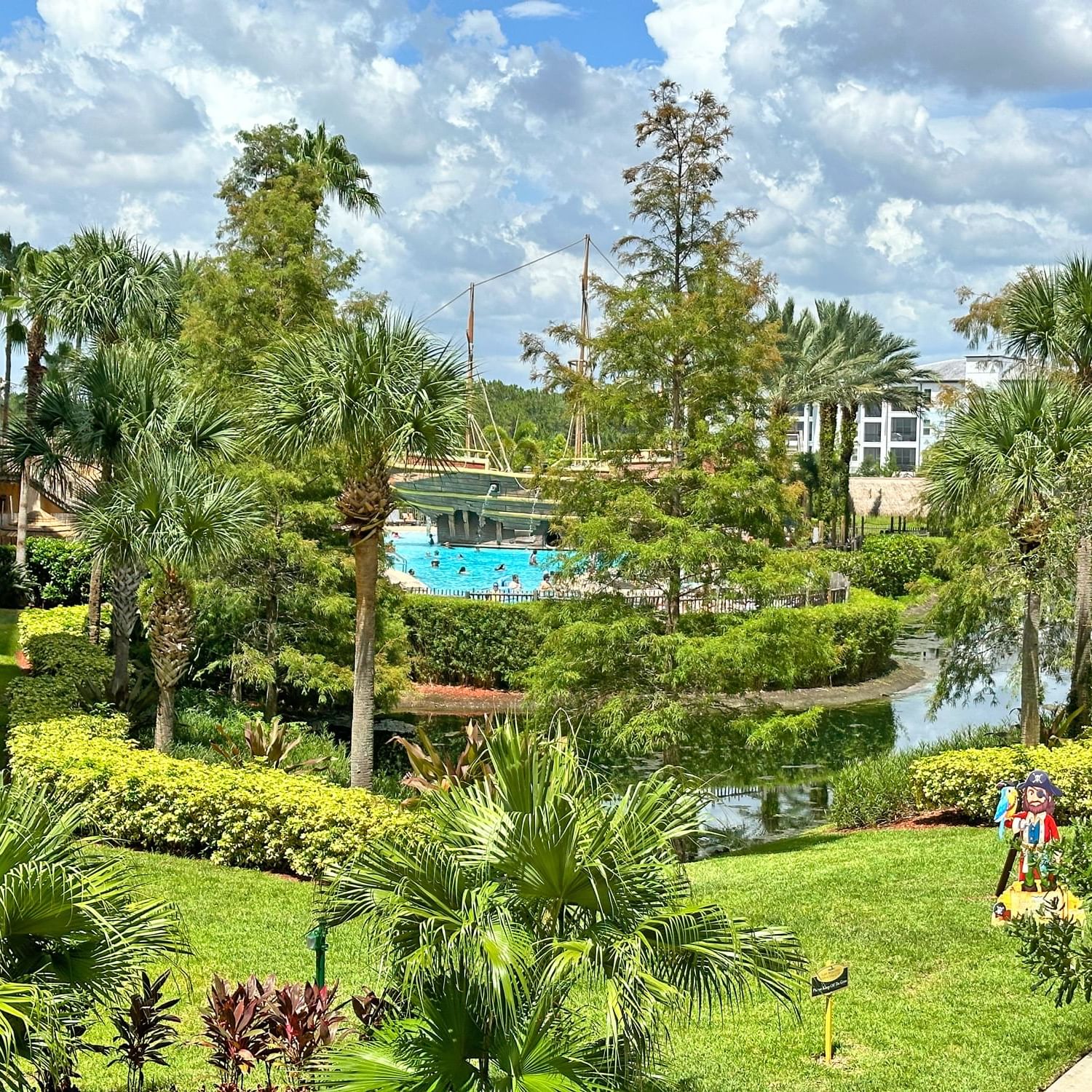 Pool area by the Lake Buena Vista Resort Village & Spa's garden with lush greenery