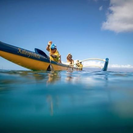 Group on a canoe in the ocean at Ka'anapali Beach Hotel Hawaii