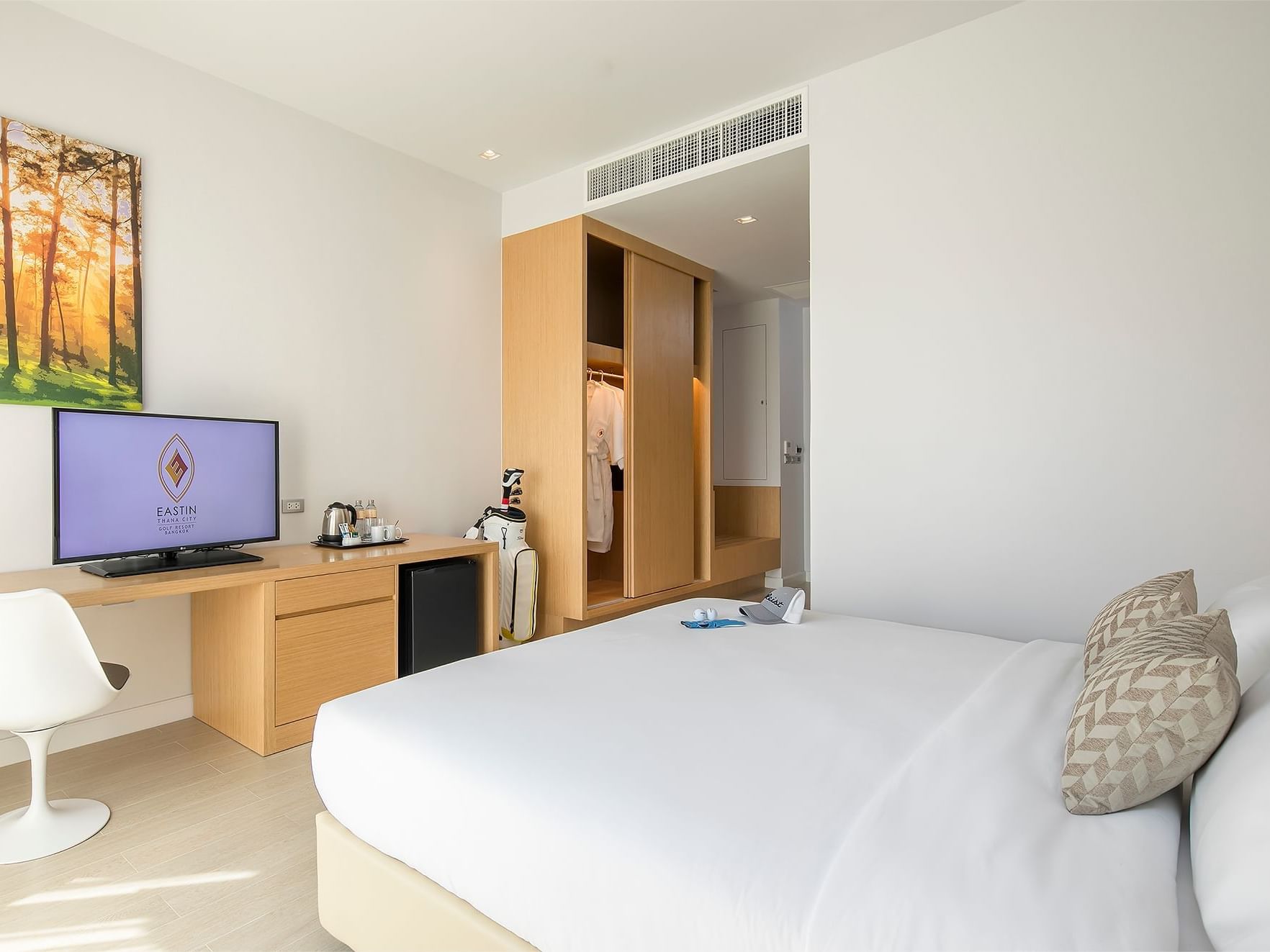Bed & Tv stand in Superior Golf Course View at Eastin Hotels