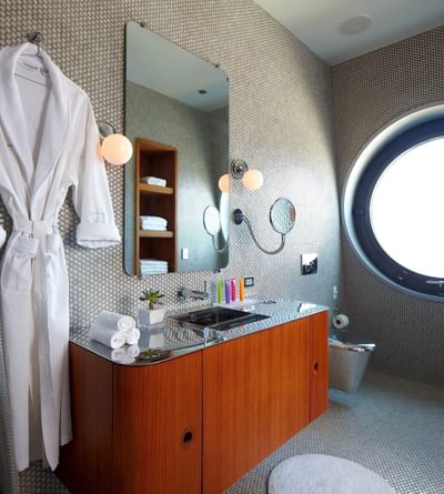 A bathrobe hanging in a bathroom at Dream Downtown NYC