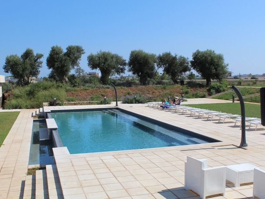 Outdoor pool area with the lounge at Masseria Stali