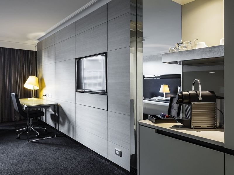 Sleek Nespresso machine and flat-screen television in the Executive Room at Pullman Brisbane King George Square