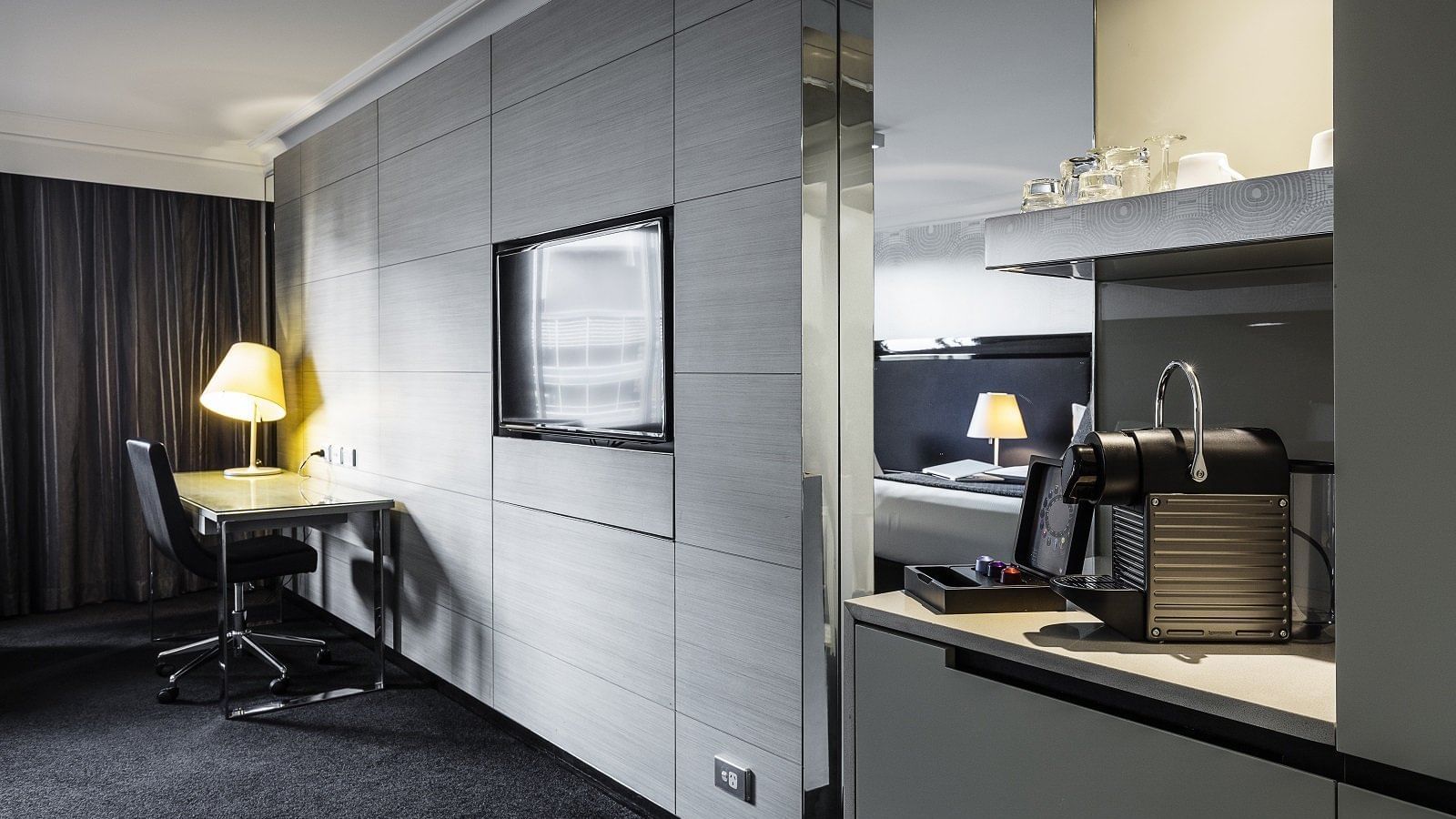 Sleek Nespresso machine and flat-screen television in the Executive Room at Pullman Brisbane King George Square