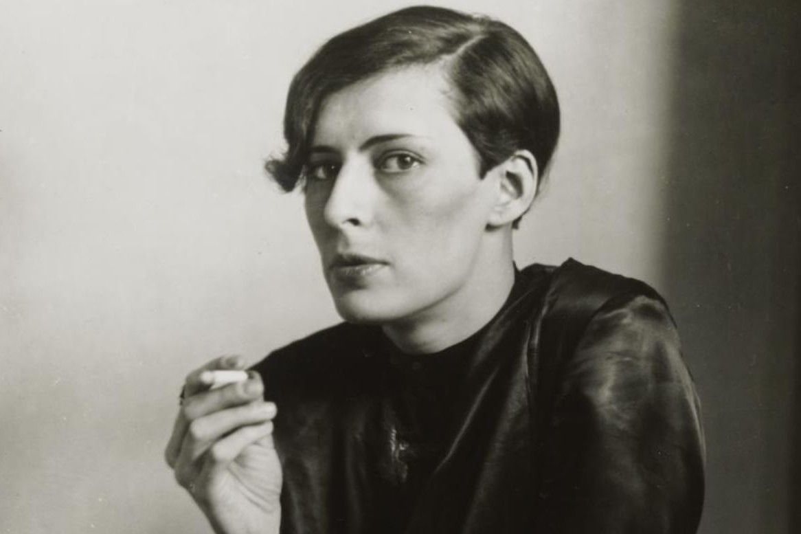 Historic black and white portrait of a woman with short hair and a cigarette, showcasing 1920s and 1930s photography at the Leopold Museum in Vienna