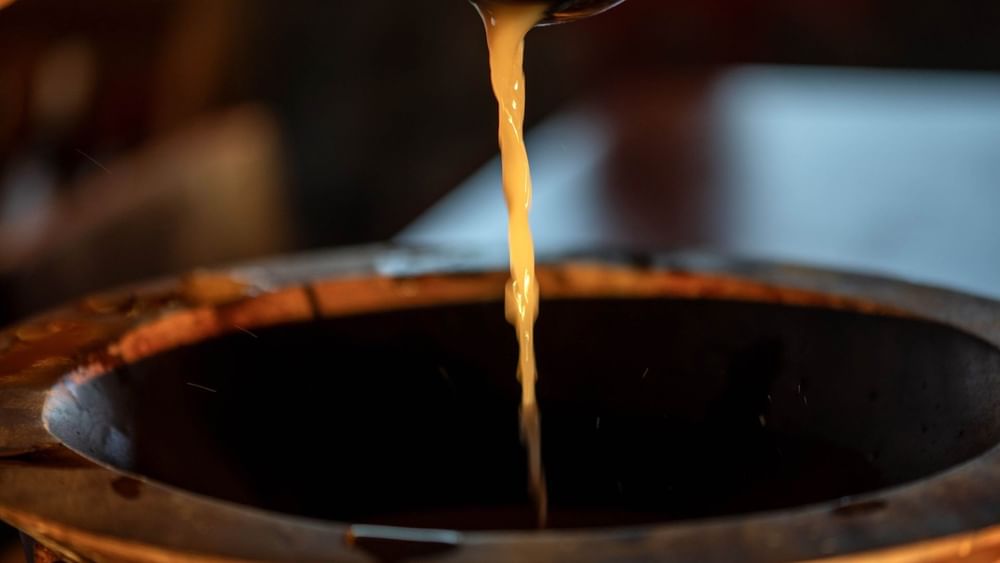 Liquid pouring into copper vessel at Warwick Fiji Resort and Spa Korolevu.