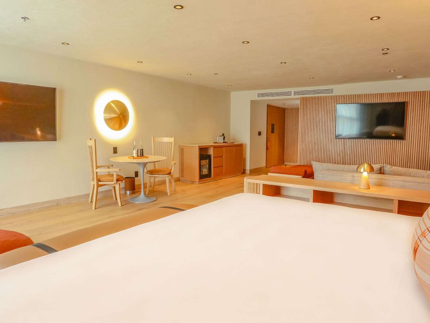 King Superior Junior Suite with dining area and large bed at Camino Real Polanco Mexico, Ciudad de Mexico.