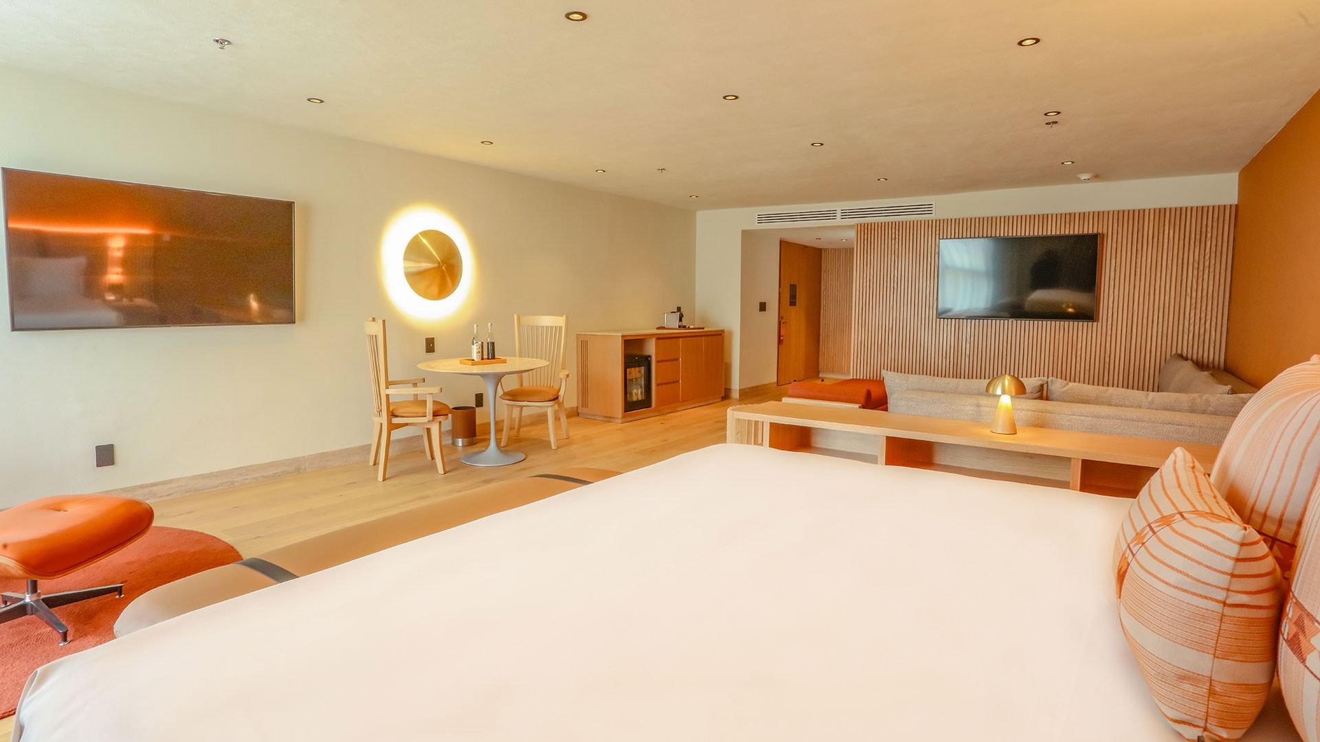 King Superior Junior Suite with dining area and large bed at Camino Real Polanco Mexico, Ciudad de Mexico.