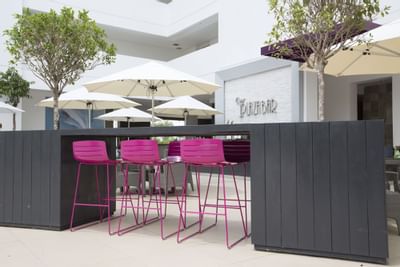 A chair setting in the Plaza Bar at Playa Blanca Beach Resort