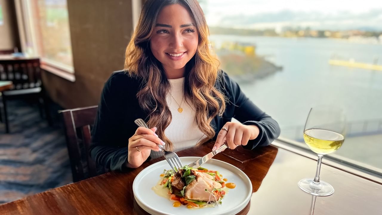 Smiling girl eating lunch at the Blue Crab