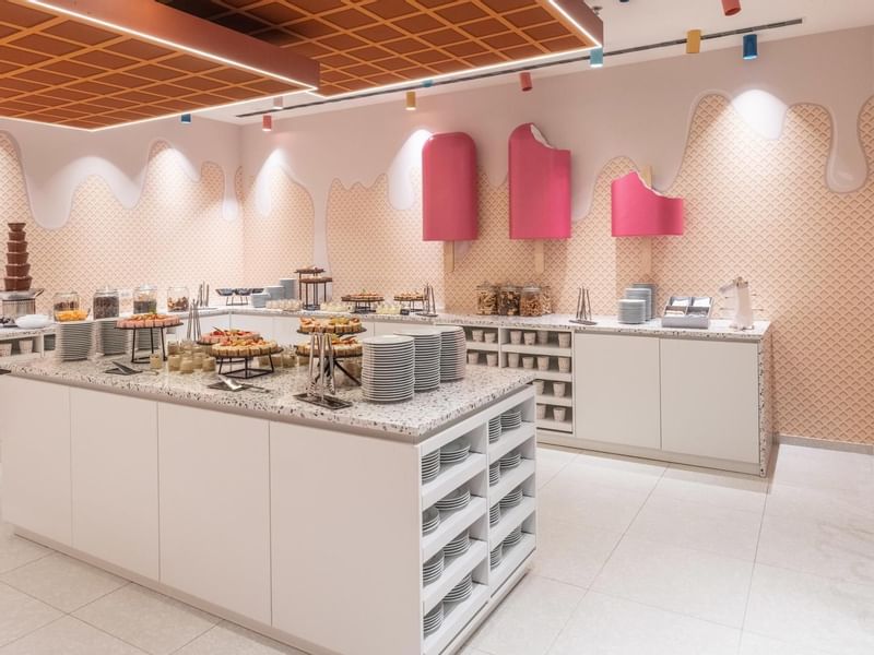 Candy Shop with waffle cone wall design and ice cream cone lamps at Falkensteiner Family Hotel Diadora