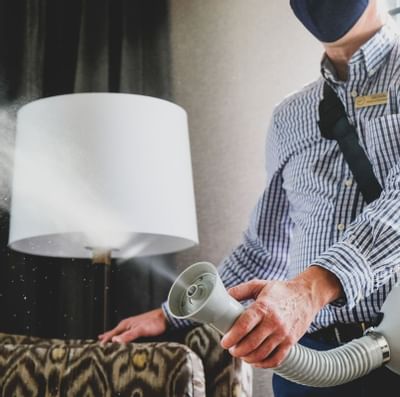 An employee disinfecting The Paramount Hotel Portland