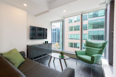 Livingroom with a sofa & television at ReStays Ottawa