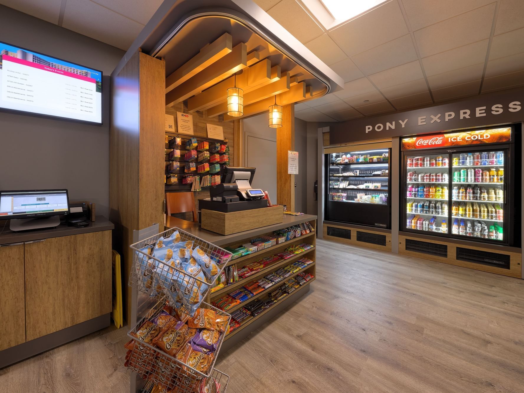 Pony Express convenience store with refrigerators stocked with beverages at the NCED Hotel and Conference Center.