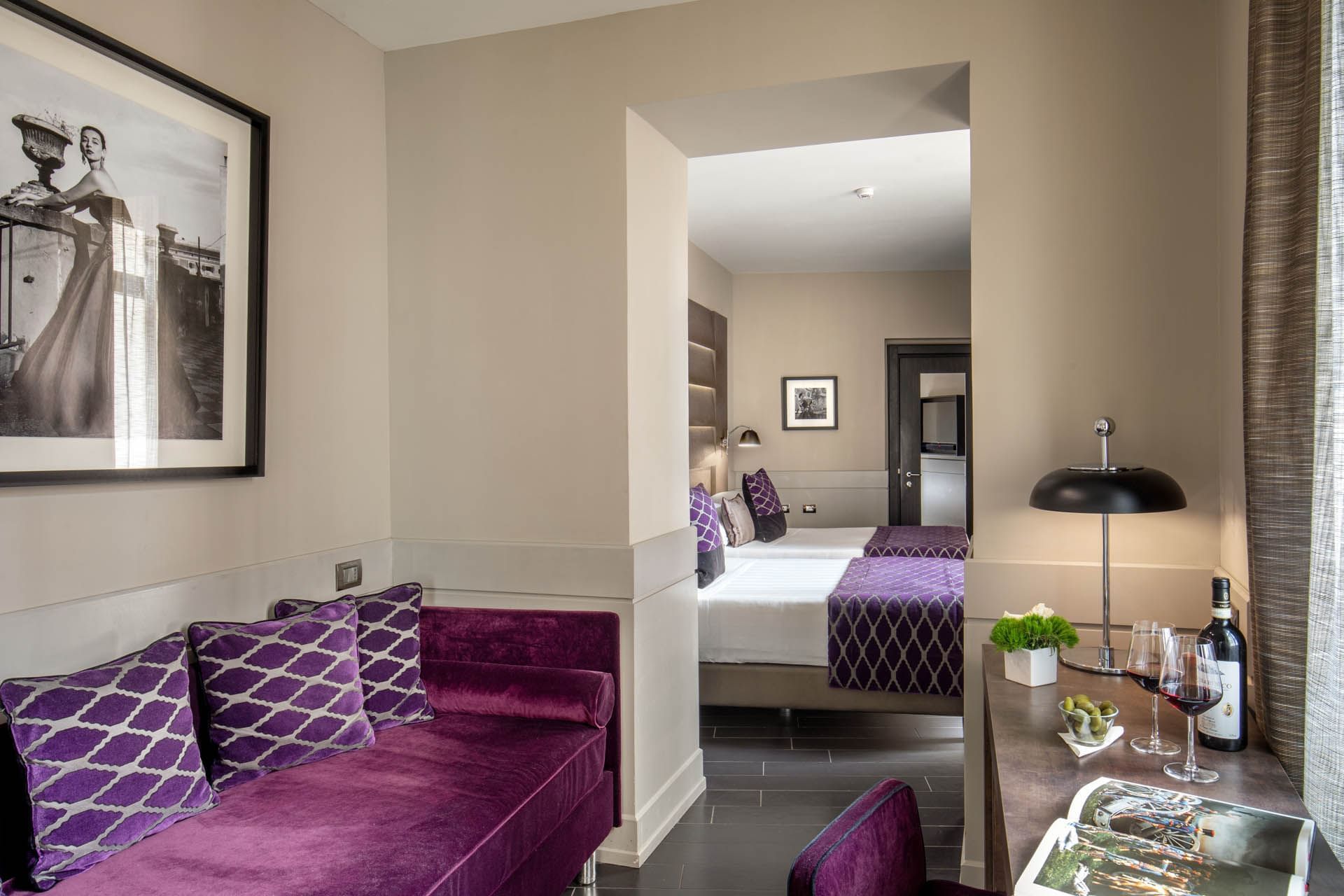 The lounge area with comfy sofa and working space in Junior Suite at The Style