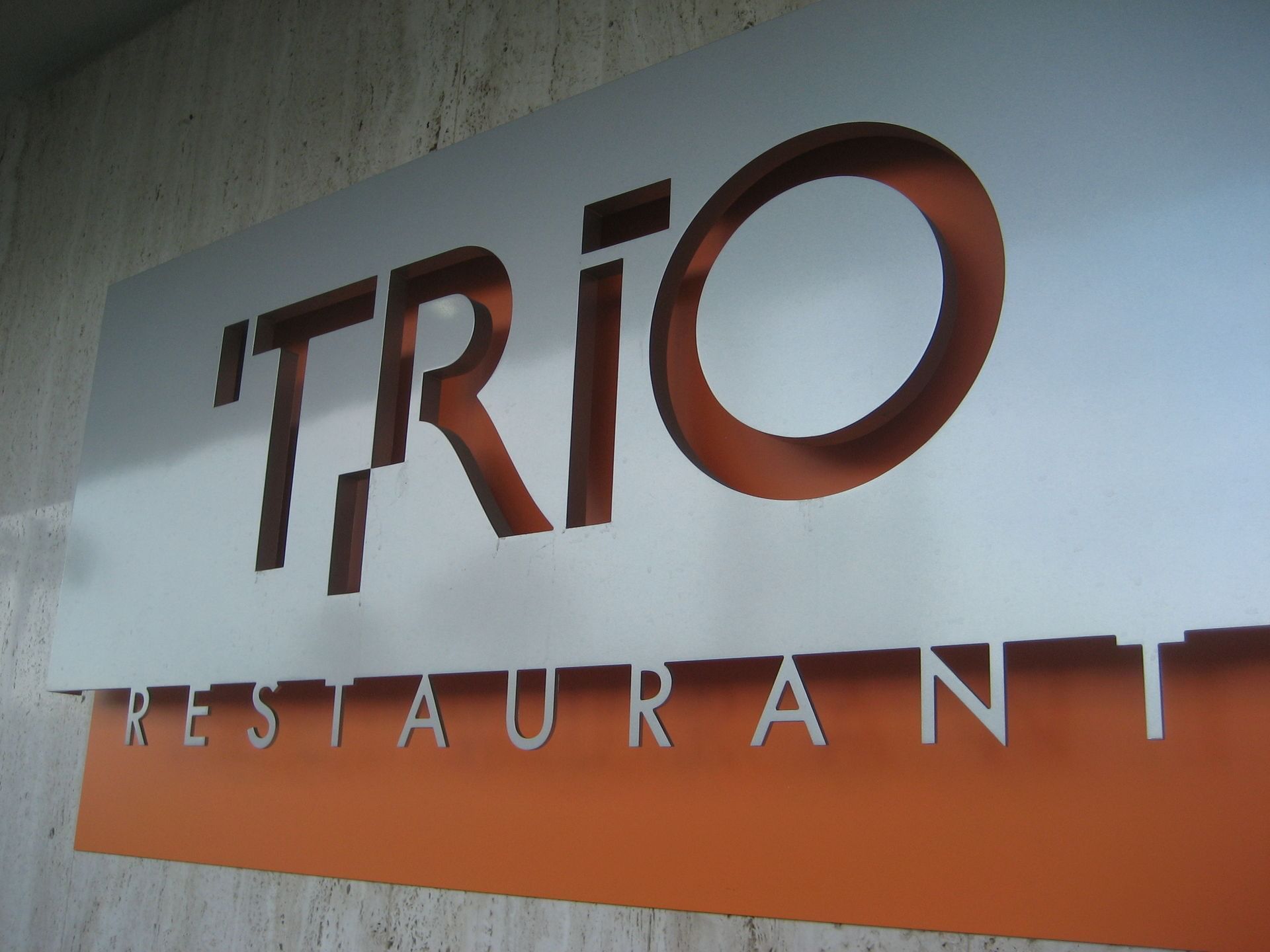 Entrance sign of Trio restuarant at 7 Springs Inn & Suites