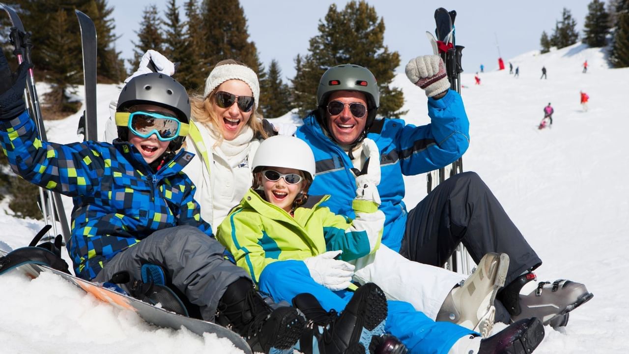 family smiling on the ski mountain