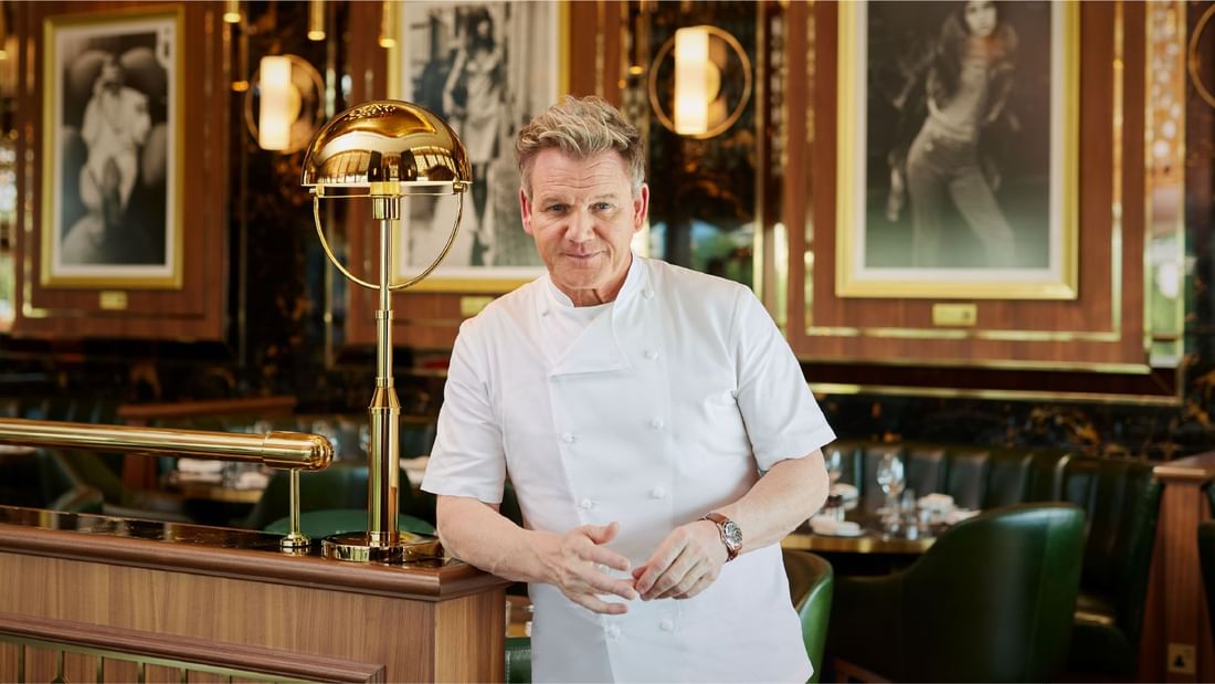 Chef Gordon Ramsay standing confidently at Gordon Ramsay Bar & Grill at Sunway Resort