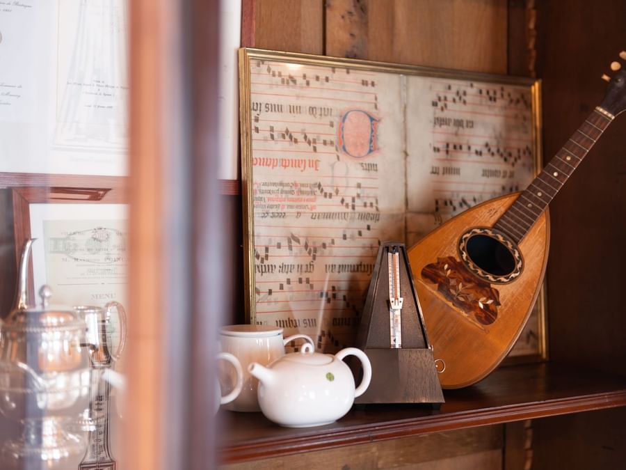 Tea pot on table with mandolin at LeCoq-Gadby Hotel & Spa