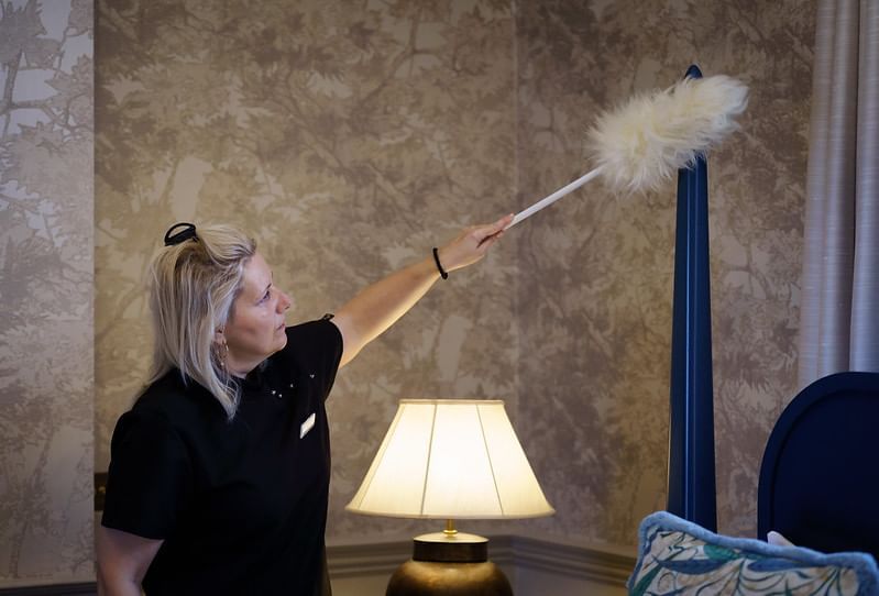 Hotel Staff dusting the furniture at Richmond Hill Hotel