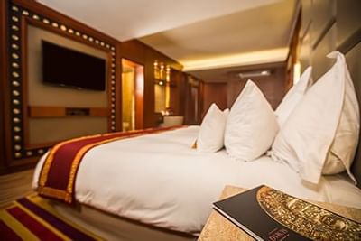 Close up on the king bed in a room at Hotel Sumaq