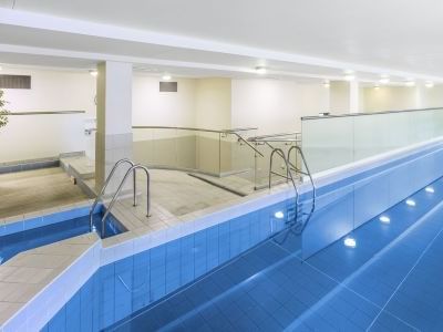 An indoor pool area at Hotel Grand Chancellor