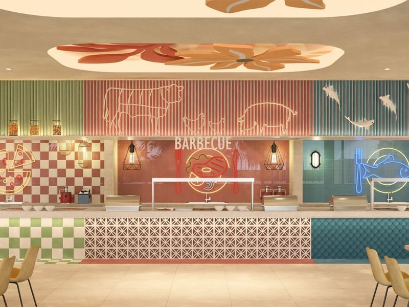 Vibrant barbecue-themed buffet station at Fiesta Americana Funeeq with neon signs and a modern design