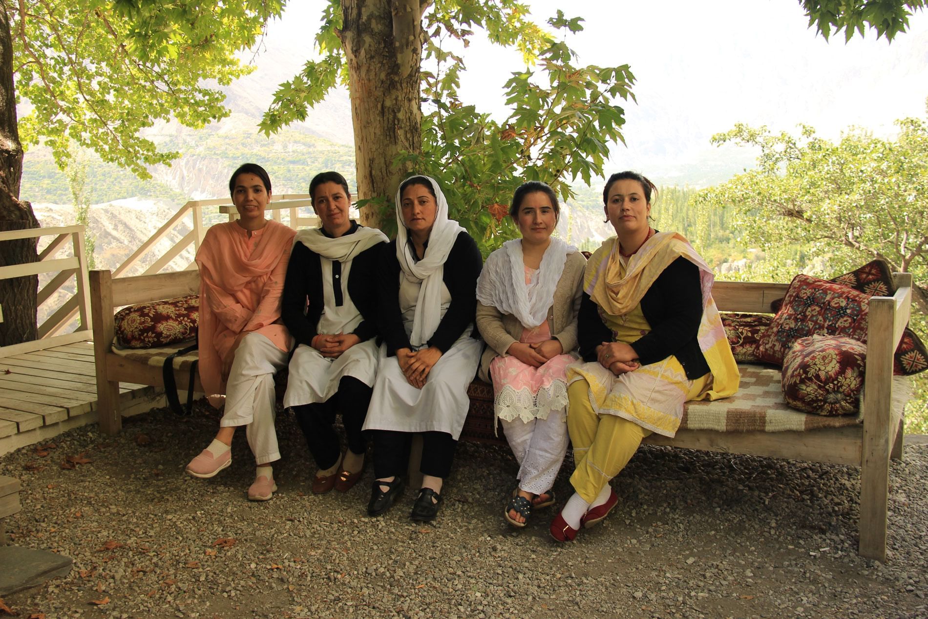 Ladies sitting under a tree in Khabasi at Serena Altit Fort