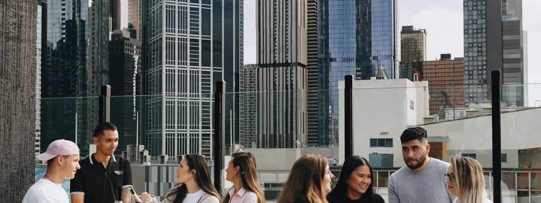 People dining in Blossom Rooftop at Pullman Melbourne City