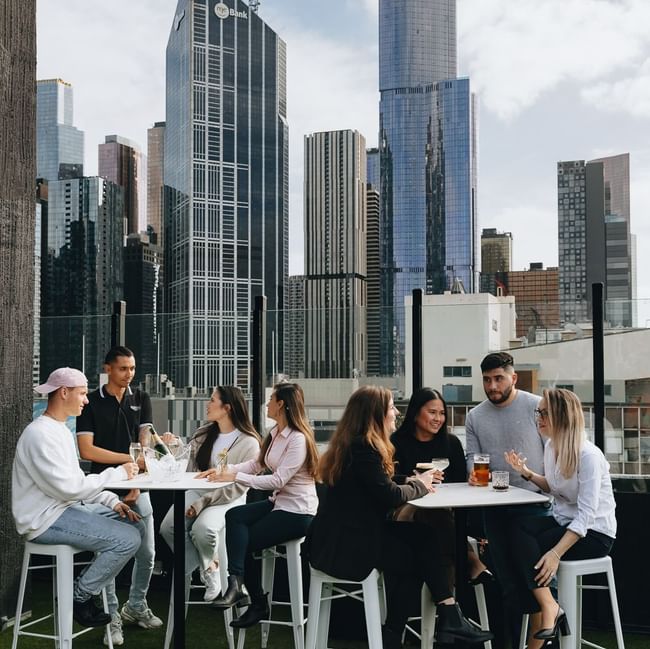 People dining in Blossom Rooftop at Pullman Melbourne City