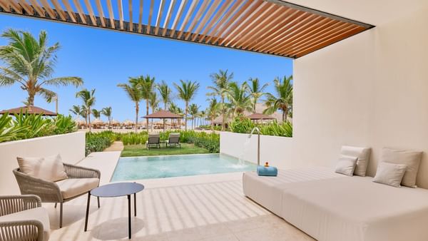 Outdoor pool with lounge area in Tierra Suite at Live Aqua Punta Cana