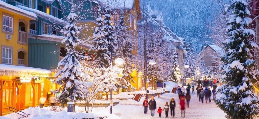 Whistler village winter stroll with snow covered streets and glowing lights