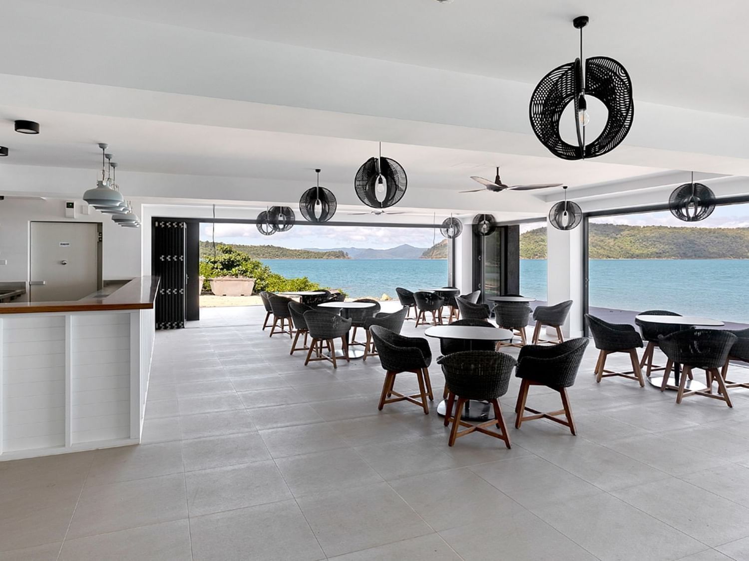 Dining tables near the counter of Tidal Lounge, Daydream Island