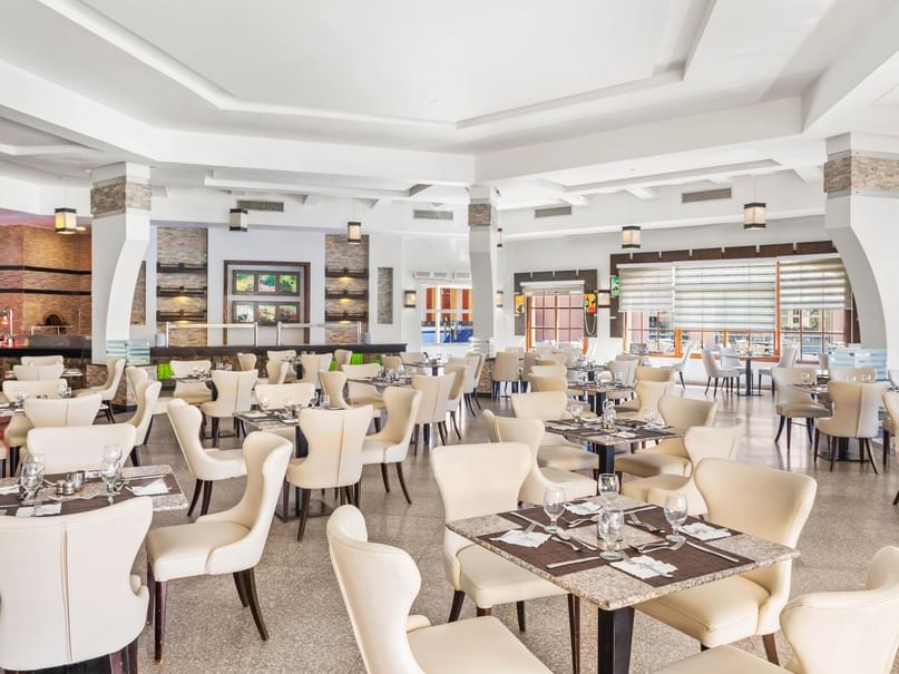 Elegant dining room with tables and chairs at Le Marché in Neverland City Hurghada, Hurghada.