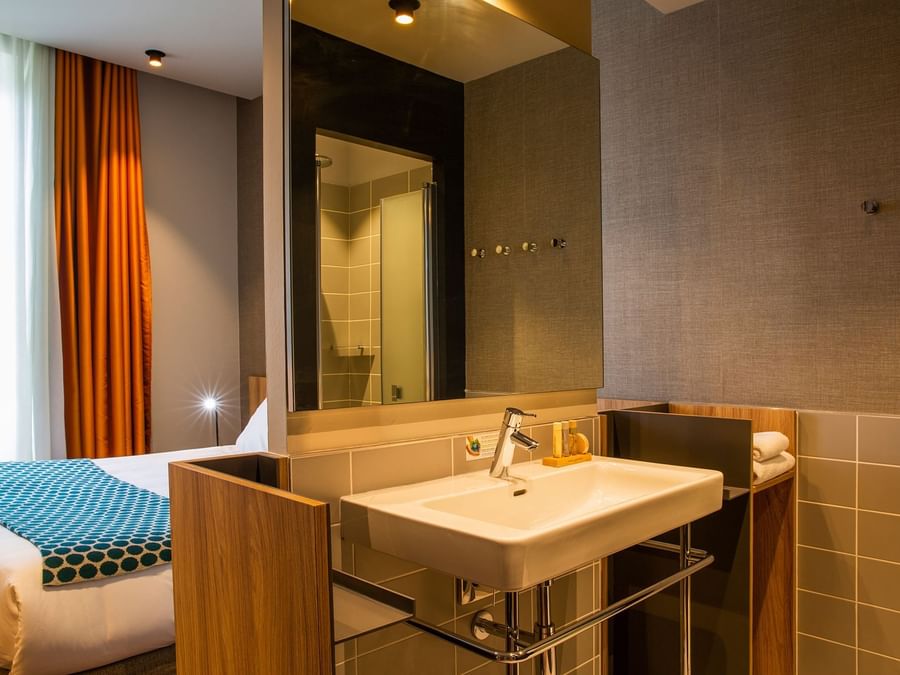 Bathroom vanity in bedrooms at Hotel des Sources