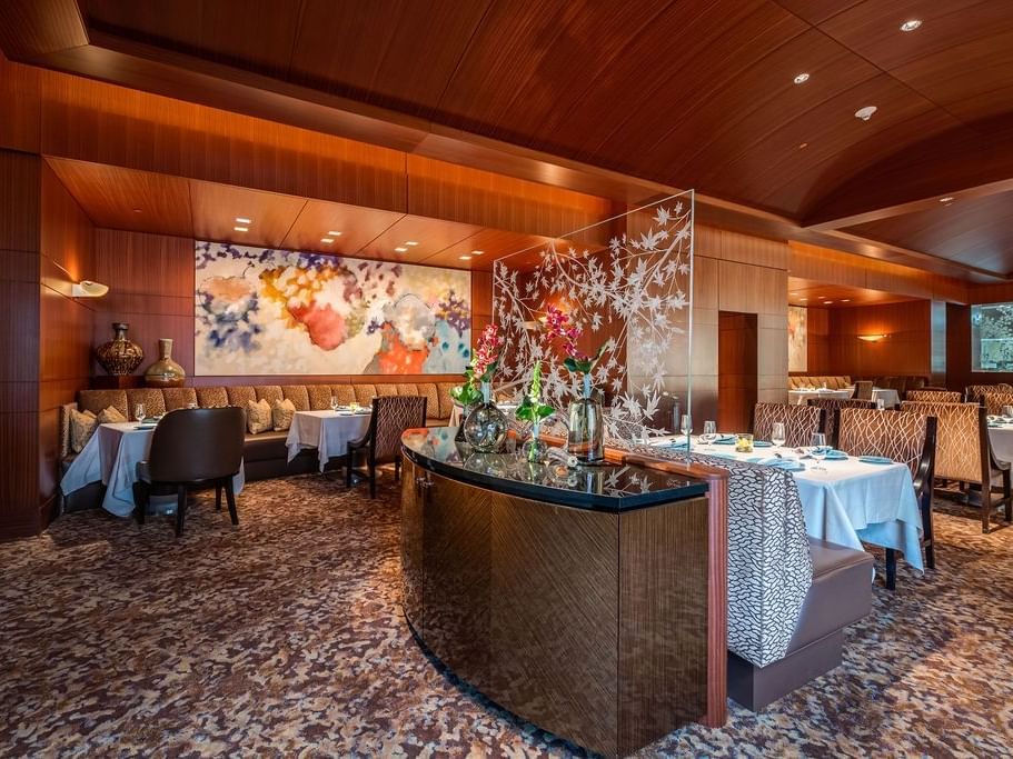 Elegant dining area with a warm embrace in Herons at The Umstead Hotel and Spa